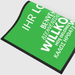 Fussmatte Willkommen grün mehrsprachig mit Logo, 80x120cm